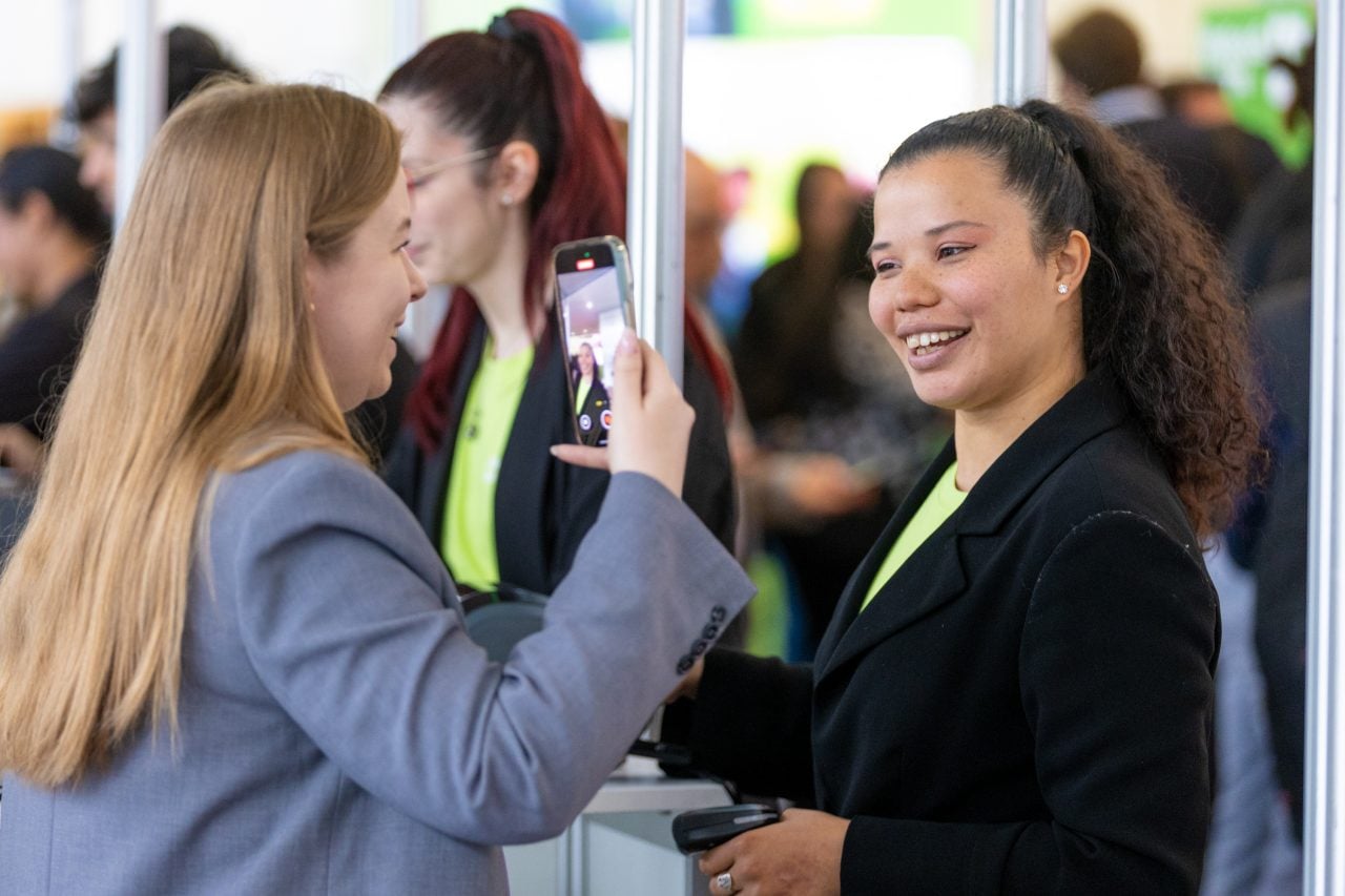 exhibitor talking to visitors